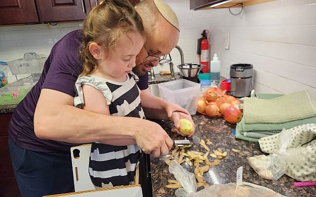 Abba and daughter, learning to peel potatoes!