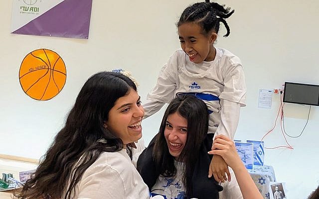 National Service volunteers at Jewish National Fund-USA affiliate ADI Negev-Nahalat Eran are all smiles while celebrating Yom Haatzmaut with residents and students with severe disabilities.