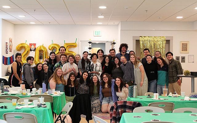 Senior student celebration with Interim President Patricia A. Prelock holding the inagural Patricia A. Prelock Ally to the Jewish People Award.