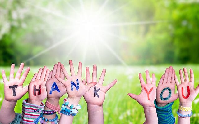 'Thank you' painted on kids' hands. (iStock)