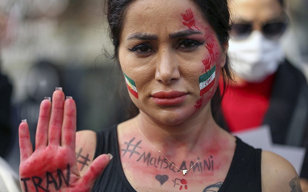 An Iranian woman shows her hand to protest the death of Mahsa Amini during a demonstration outside the Iranian consulate in Istanbul, Turkey, Monday, Oct. 17, 2022. Amini, a 22-year-old woman who had been detained by Iran's morality police in the capital of Tehran for allegedly not adhering to Iran's strict Islamic dress code, died while in police custody. (AP Photo/Emrah Gurel) An Iranian woman shows her hand to protest the death of Mahsa Amini during a demonstration outside the Iranian consulate in Istanbul, Turkey, Monday, Oct. 17, 2022. Amini, a 22-year-old woman who had been detained by Iran's morality police in the capital of Tehran for allegedly not adhering to Iran's strict Islamic dress code, died while in police custody. (AP Photo/Emrah Gurel)