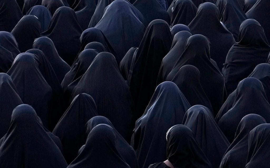 Women attend the funeral ceremony of Iranian Revolutionary Guard members who were killed in an airstrike in Syria, in Tehran, Iran, Monday, Jan. 22, 2024. (AP Photo/Vahid Salemi)