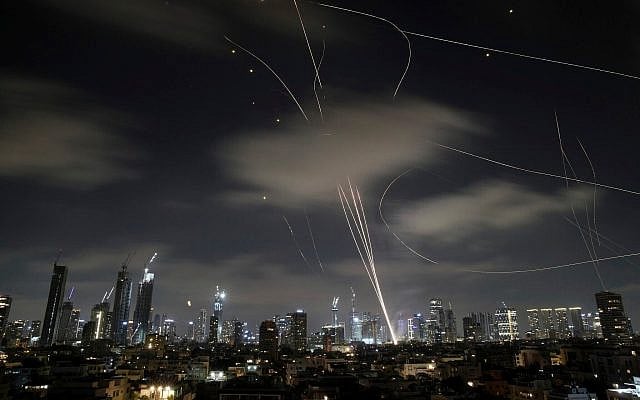 Israeli air defense systems fire to intercept missiles during an Iranian attack over Tel Aviv, Israel, June 18, 2025. (AP/Leo Correa)