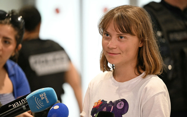 Anti-Israel, pro-Palestinian activist Greta Thunberg talks to journalists upon her arrival to Roissy-Charles de Gaulle Airport, after being deported by Israel on a flight to Sweden via France, following her detention along with other activists aboard a Gaza-bound boat, on June 10, 2025. (Hugo MATHY / AFP)