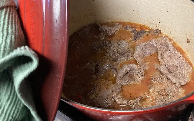 A peek into the Swiss steak pot as it cooks.