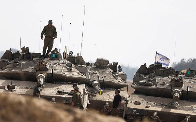 Israeli soliders stand next tanks parked near the Israel-Gaza border, amid the ongoing conflict between Israel and Hamas, in Israel, May 19, 2025 (Ronen Zvulun/REUTERS) Israeli soliders stand next tanks parked near the Israel-Gaza border, amid the ongoing conflict between Israel and Hamas, in Israel, May 19, 2025 (Ronen Zvulun/REUTERS)