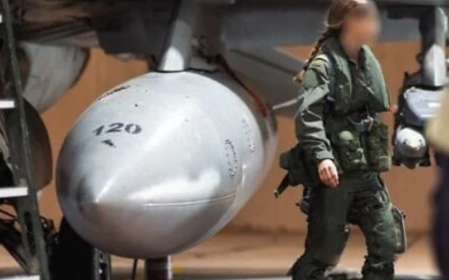 Maj. Shin, a female navigator in the Israeli Air Force, is pictured alongside her fighter jet in an undated photo released for publication on June 14, 2025 (©️Israel Defense Forces)