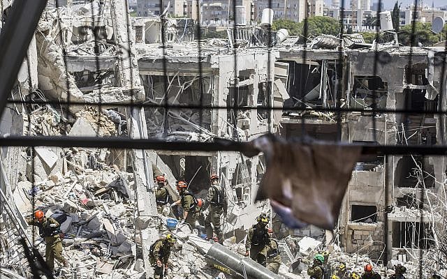 Though it is far from over and though there are mounting Israeli civilian casualties, Israel won this war -- by virtue of starting it.  Above: apartments in Bat Yam just south of Tel Aviv destroyed in an Iranian missile strike on Saturday (June 15); 7 people, including 2 children, were killed.
Photo by: Rina Castelnuovo