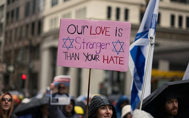 At the Unity Rally against antisemitism in San Francisco, an activist holds a sign that reads, “OUR LOVE IS STRONGER THAN YOUR HATE.” Photo: Unsplash