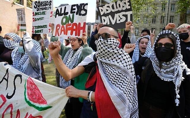 Pro-Palestinian, anti-Israel students and demonstrators shout slogans at the campus of SOAS University of London as students occupy parts of university campus in London, Wednesday, May 8, 2024. (AP Photo/Kin Cheung)
