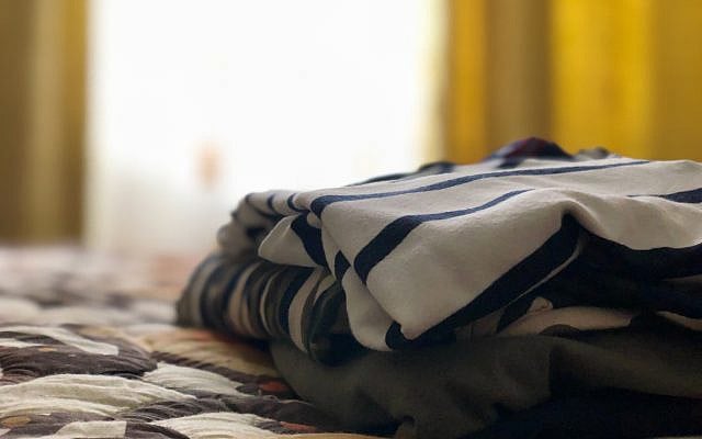 Clothes on the bed. (iStock)