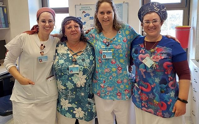 Pictured: HMO Head Nurse Talia Cohen (2nd from right) with her Mount Scopus Hospital staff Yael (from left to right), Yifat (Assistant Head Nurse), and Shira. Photo courtesy of the author. Pictured: HMO Head Nurse Talia Cohen (2nd from right) with her Mount Scopus Hospital staff Yael (from left to right), Yifat (Assistant Head Nurse), and Shira. Photo courtesy of the author.