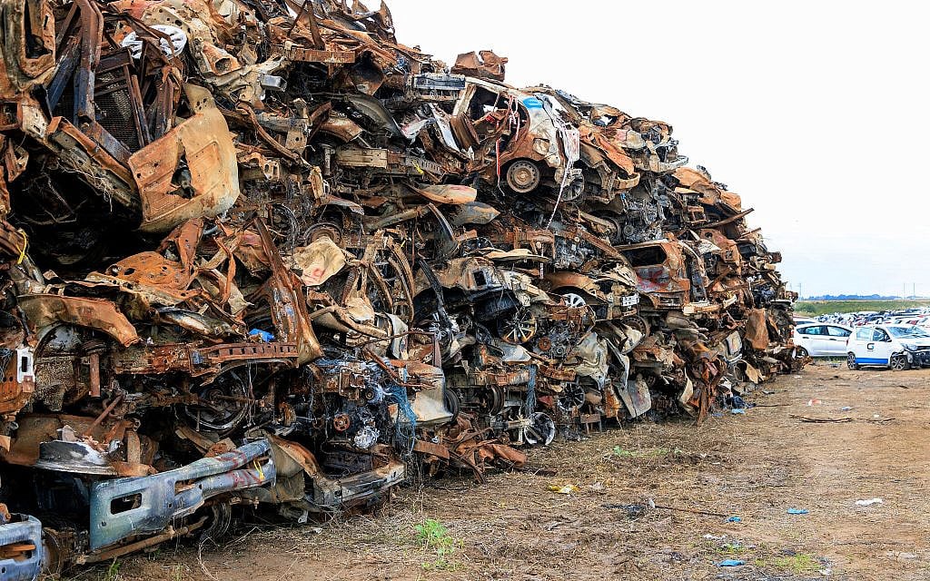 Cars destroyed by Hamas terrorists in the October 7 attack on southern Israel, made into a memorial wall near Moshav Tekuma, seen on January 3, 2024. (Moshe Shai/ FLASH90)