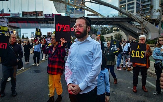 Far-left Haredi journalist Israel Frey attends a protest calling for the release of the hostages held in the Gaza Strip, outside the IDF headquarters in Tel Aviv, April 8, 2024. (Avshalom Sassoni/Flash90)