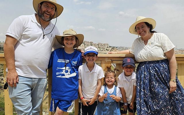 This is us, last Yom Haatzmaut, Israel Independence Day, enjoying the view of the rolling hills of Judea, one street below our house. (courtesy)