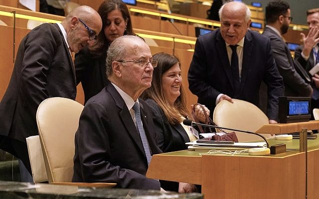 Palestinian Prime Minister Mohammed Mustafa, foreground, arrives to address the United Nations General Assembly, Monday, July 28, 2025. (AP Photo/Richard Drew)