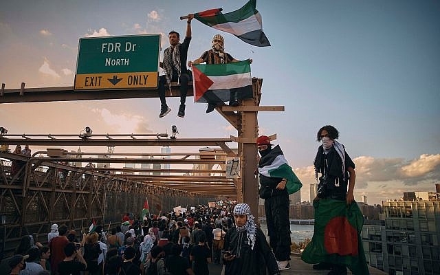 Protesters shout slogans as they cross Brooklyn Bridge during a pro-Palestinian, anti-Israel demonstration demanding a ceasefire in Gaza, Oct. 28, 2023, in New York. (AP Photo/Andres Kudacki)
