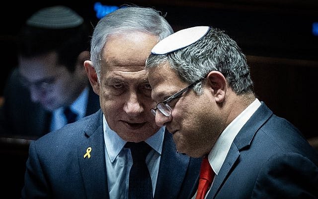 Prime Minister Benjamin Netanyahu (left) and then-newly reinstated National Security Minister Itamar Ben Gvir (right) in the Knesset plenum in Jerusalem, March 19, 2025. (Yonatan Sindel/Flash90)