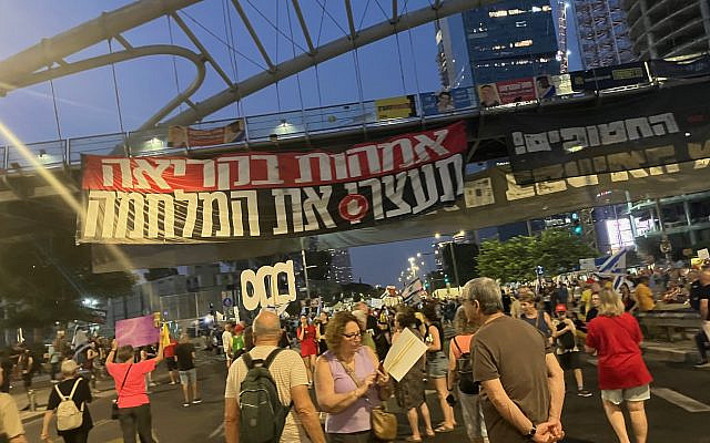 The sign 'Mothers call to stop the war,' from last Saturday, my photo.