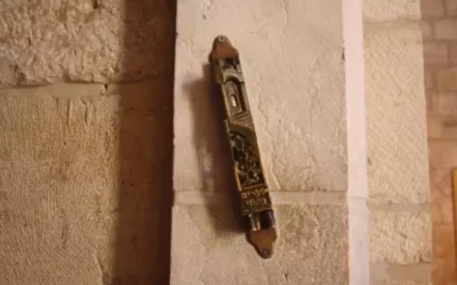 A Mezuzah at the entrance to a home A Mezuzah at the entrance to a home