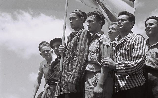 Haifa, Mandatory Palestine. Buchenwald Concentration Camp survivors arrive in Haifa on the immigrant ship RMS Mataroa, 1945. (No copyright restrictions, via Wikimedia Commons).