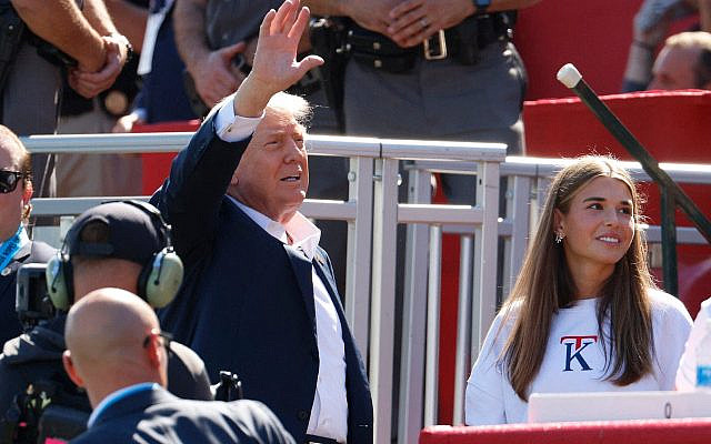 Photo: President Donald Trump waves to the crowd on the first tee as his granddaughter Kai Madison Trump looks on at the Ryder Cup at Bethpage Black Golf Course in Farmingdale, New York, Sept. 26, 2025. (Imagn Images via Reuters/Peter . 