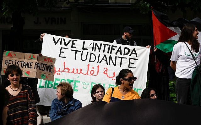 Students shout slogans and display a banner reading "Long live the student intifada" as they take part in an anti-Israel rally at the Sorbonne University in Paris on April 29, 2024. (Geoffroy Van Der Hasselt/AFP)
