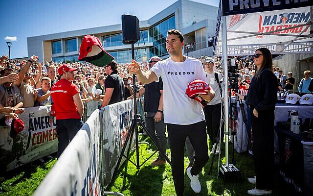 Charlie Kirk hands out hats before speaking at Utah Valley University in Orem, Utah, September 10, 2025, shortly before his death. (Tess Crowley/The Deseret News via AP/TOI)