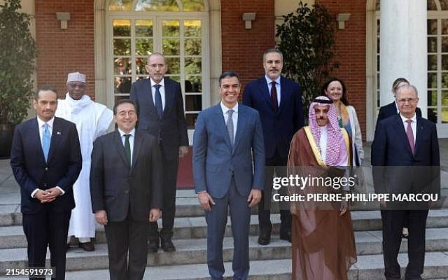 Spain's Prime Minister Pedro Sanchez (C) and Foreign Minister Jose Manuel Albares (3L) pose for a family photo with Qatari Prime Minister Sheikh Mohammed bin Abdulrahman Al-Thani