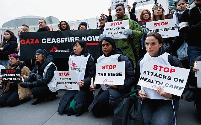 Doctors Without Borders staff gather at UN headquarters in New York to protest Israel's actions in Gaza, December 6, 2023, in New York. (Sara Kerens/AP Images for Doctors Without Borders)