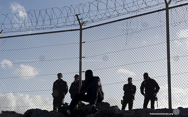 The separating fence between occupied Ceuta and Morocco, a steel scar across African soil, witnesses each year waves of desperate migration and tragedies at Europe’s gate. (Fotomovimiento/Flickr)