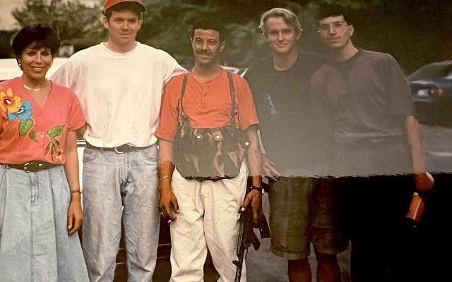 Linda Scherzer (L) with her TV crew and, (CTR) holding Kalashnikov, a security guard from Ahmed Jibril's PFLP-GC. Damascus, 1995 (Courtesy)