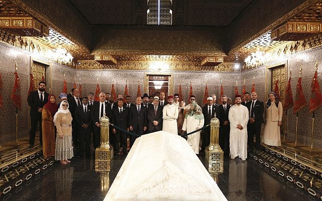 Jewish-Muslim delegation praying together at the graves of the Kings of Morocco. Credit: Sharaka