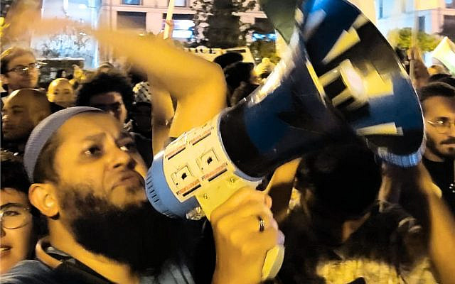 Pro-Palestinian protesters in Martim Moniz Square. I took this photograph on 18 October 2023, mere days after the massacre of 7 October.