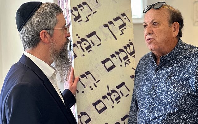 Rabbi Shlomo Beitsh (left) speaks with benefactor Zion Avissar at the Chabad Israeli Center in Rockville, Maryland. (Photo by Larry Luxner)