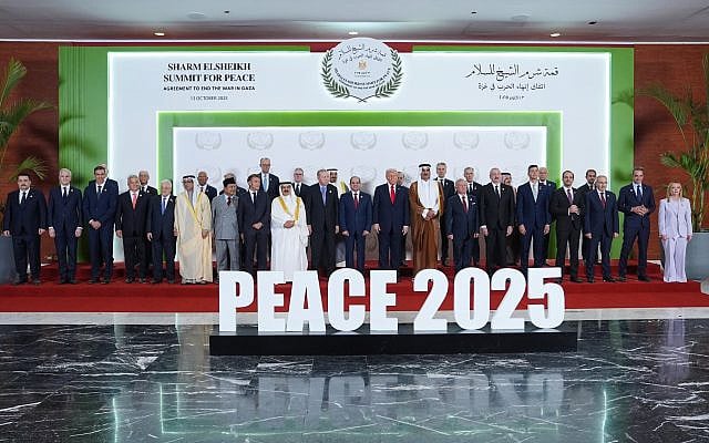 US President Donald Trump at a summit to support ending the two-year Israel-Hamas war in Gaza; Italy's Prime Minister Giorgia Meloni is the only woman on stage. October 13, 2025, in Sharm El Sheikh, Egypt. (AP Photo/Evan Vucci, Pool)