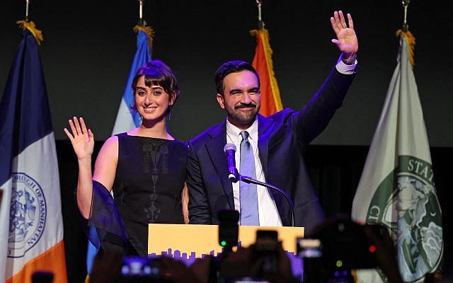 New York City Mayoral candidate Zohran Mamdani (R) celebrates victory alongside his wife Rama Duwaji (L) during an election night event at the Brooklyn Paramount Theater in Brooklyn, New York on November 4, 2025. (ANGELA WEISS / AFP)
