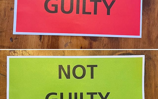 Tribunal attendees were given two slips of paper to vote on the [absent] defendants.