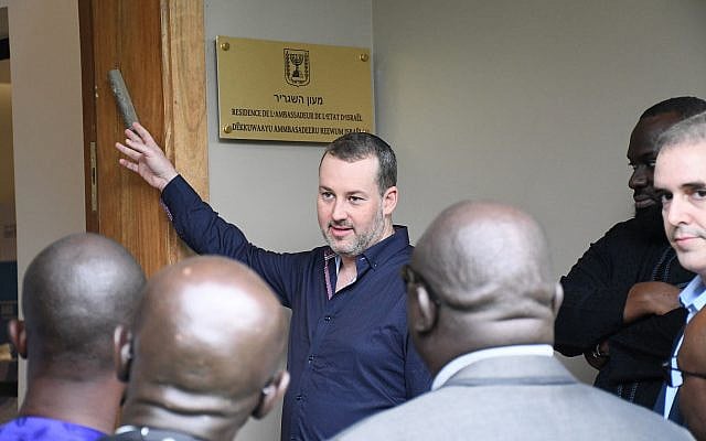 Explaining the mezuzah in Dakar, Senegal (photo credit: Albert Abone Nango)