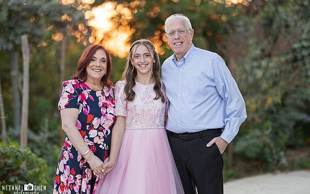 Author Miriam Aron and her husband Marc Aron and their granddaughter Bat Mitzvah Aliza Auman. Photo courtesy of the author.