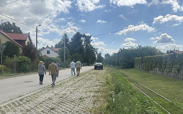 Walking along train tracks in Jędrzejów , Poland, with family in June 2025.