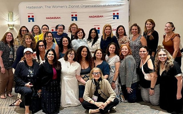 Author Sara Resnick pictured with a group of Evolve Hadassah members at the Hadassah August 2025 Meeting, Hadassah National President Carol Ann Schwartz is seated center. Photo courtesy of the author.