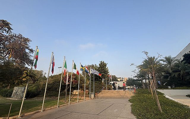 Flags at the entrance to TAU, a good place to learn to be reasonable.