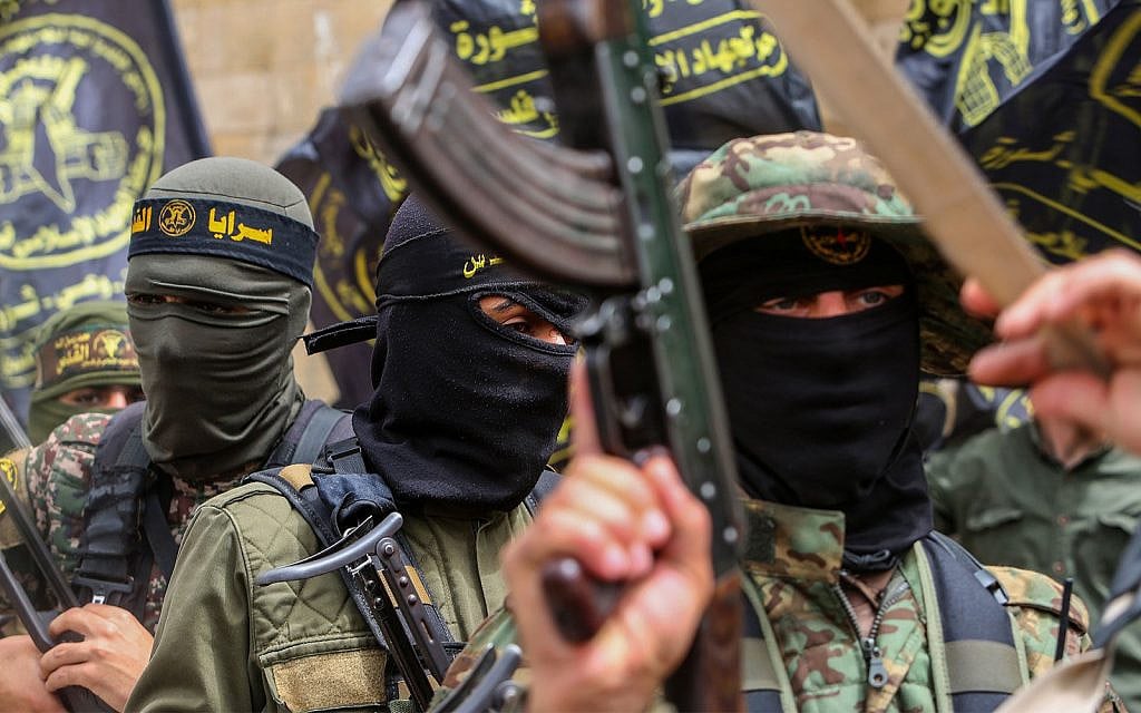 Supporters of the Hamas and Islamic Jihad terror groups take part in a rally to celebrate a shooting attack in Tel Aviv, in the southern Gaza Strip, on April 8, 2022. (Attia Muhammed/Flash90) Supporters of the Hamas and Islamic Jihad terror groups take part in a rally to celebrate a shooting attack in Tel Aviv, in the southern Gaza Strip, on April 8, 2022. (Attia Muhammed/Flash90)