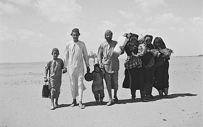 A Yemenite family expelled during the Nakba treks through the desert to a reception camp set up by the “Joint” near Aden, November 1, 1949. Public domain. Source: Wikimedia Commons.