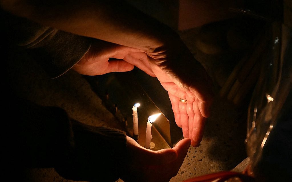 People light candles at the Bondi Pavilion in memory of the victims of a terror shooting at Bondi Beach, in Sydney on December 15, 2025. (Saeed KHAN / AFP)