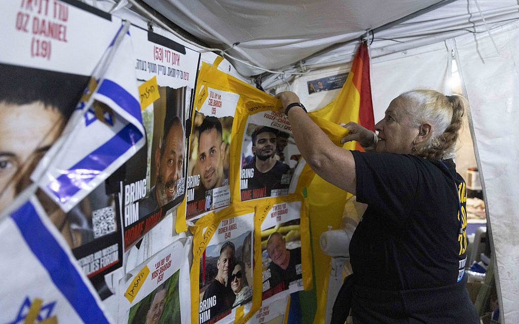 Israelis dismantle the protest tent for the release of hostages near the Prime Minister’s residence in Jerusalem, after participating in the last rally following almost two years, November 29, 2025. (Yonatan Sindel/Flash90)