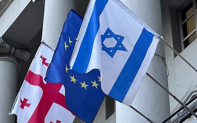 Flags of Georgia, the European Union and Israel fly outside an office building that houses the Israel-Georgia Chamber of Business. (Photo by Larry Luxner)