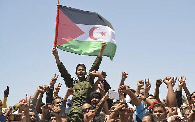 FILE - In this Friday, June 3, 2016 file photo, members of the Polisario Front, the organization disputing sovereignty over Western Sahara with Morocco, mourn their leader, Mohamed Abdelaziz, during his funerals held in the Rabouni refugees camp, south western Algeria. The 2026 World Cup contest has been engulfed in intrigue about whether Donald Trump’s rhetoric on immigration and foreign policy will cost North America votes, but what’s barely talked about is the impact of a territorial conflict that is impeding Morocco’s bid. Heavily criticized by FIFA for the lack of infrastructure and LGBT protections, Morocco’s claims on Western Sahara appear to be a factor for some countries heading into FIFA's vote on Wednesday, June 13, 2018. ( (AP Photo/Sidali Djarboub, File)