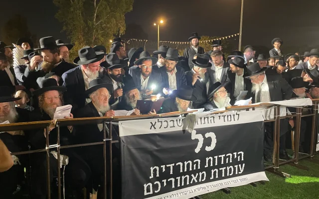 Ultra-Orthodox rabbis, including Degel HaTorah party spiritual leader Rabbi Dov Lando, attend a rally against the arrest of draft-dodging yeshiva students outside of the military prison at Beit Lid, August 14, 2025. (Sam Sokol/The Times of Israel)